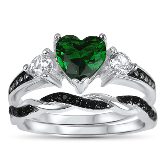 Front view of the women's heart-cut green emerald bridal ring set, showing the engagement ring and matching wedding band on white.