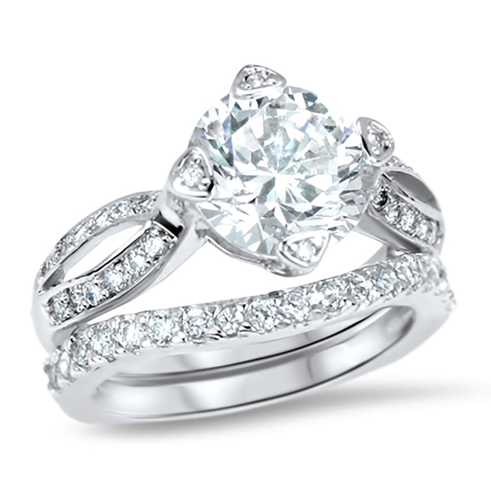 Angled view of the women's cz bridal ring set, showing the engagement ring and matching wedding band on white.