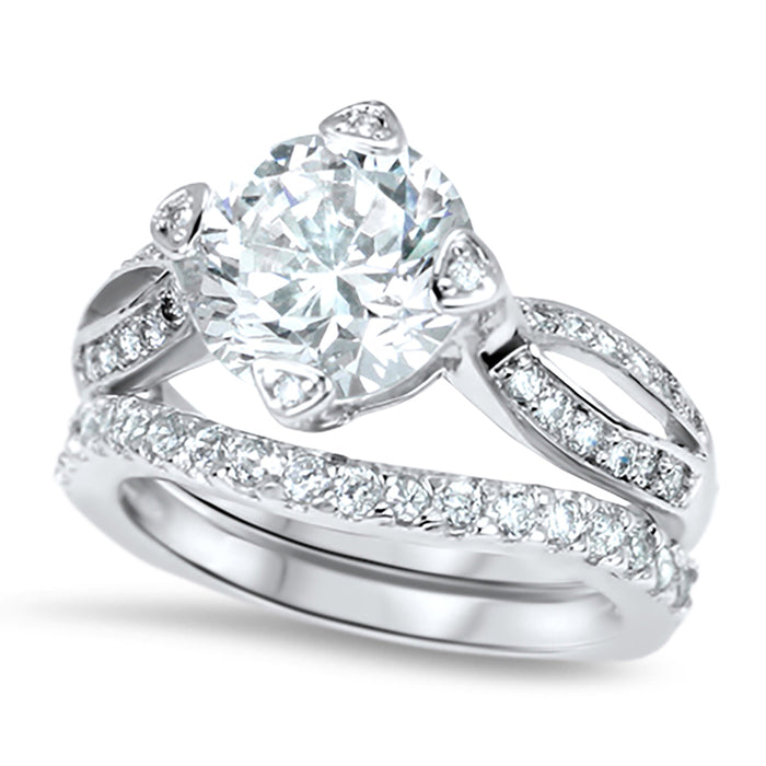 Side view of the women's cz bridal ring set, showing the engagement ring and matching wedding band on white.