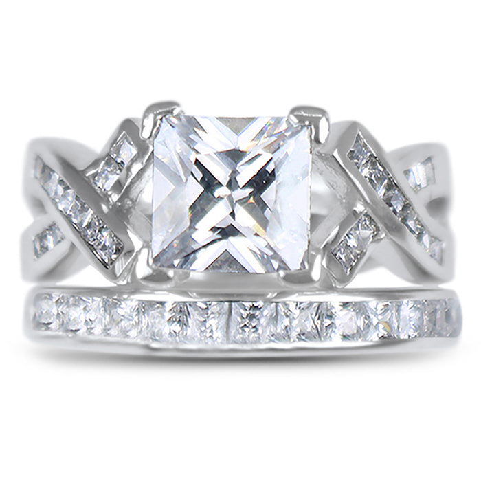 Angled view of the women's cz bridal ring set, showing the engagement ring and matching wedding band on white.