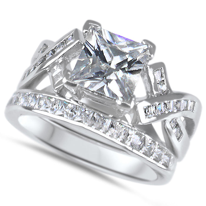 Side view of the women's cz bridal ring set, showing the engagement ring and matching wedding band on white.