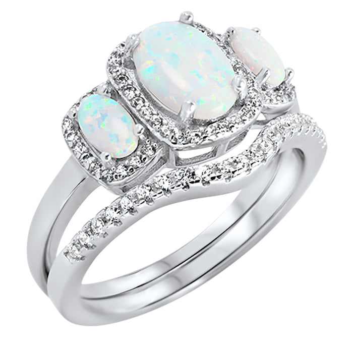 Side view of the women's white opal bridal ring set, showing the engagement ring and matching wedding band on white.