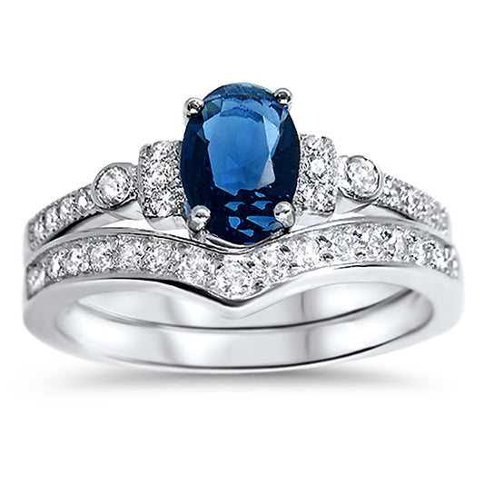 Front view of the women's sapphire bridal ring set, showing the engagement ring and matching wedding band on white.